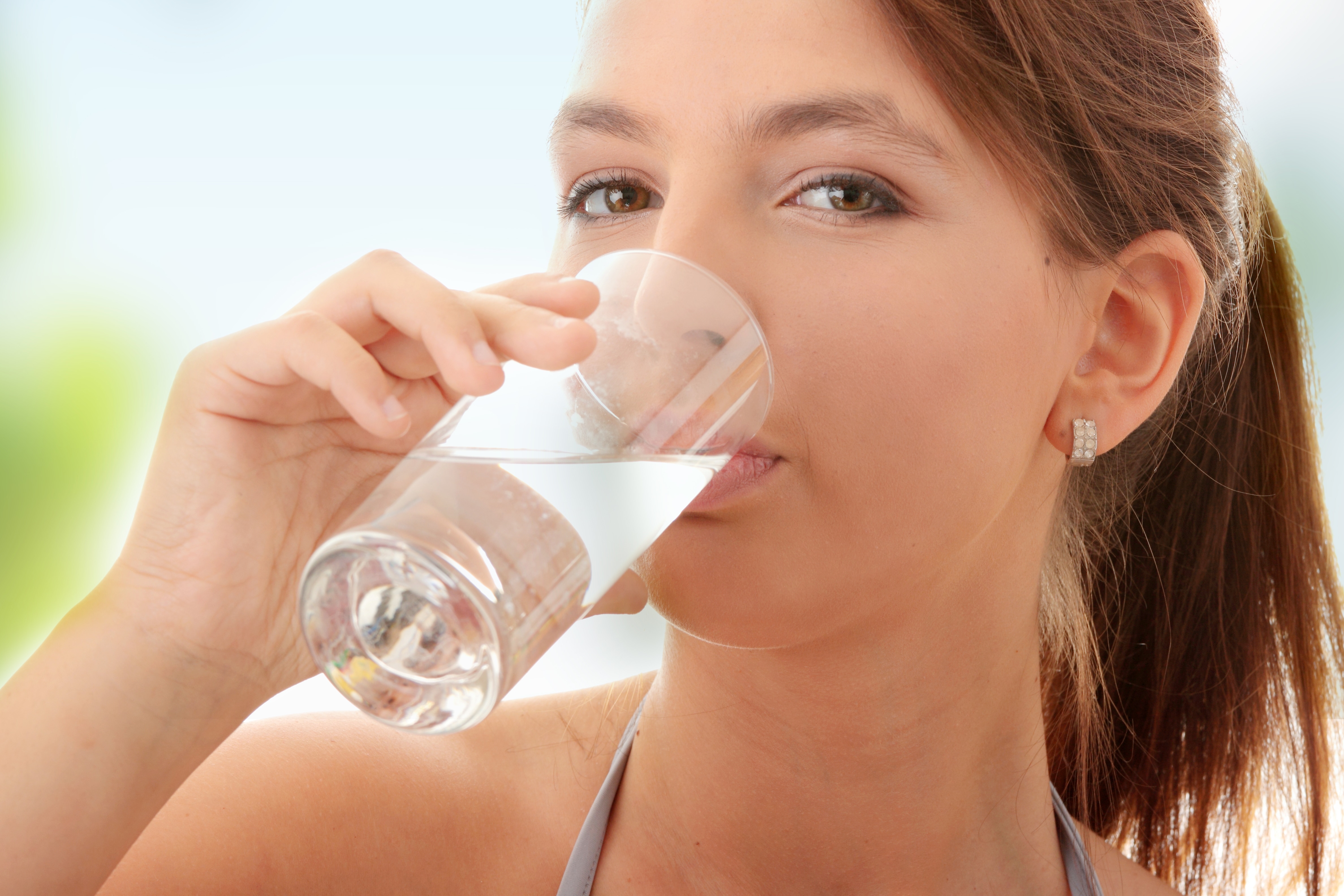 Woman drinking glass of water