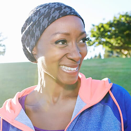 Woman wearing a head cover is looking to the side